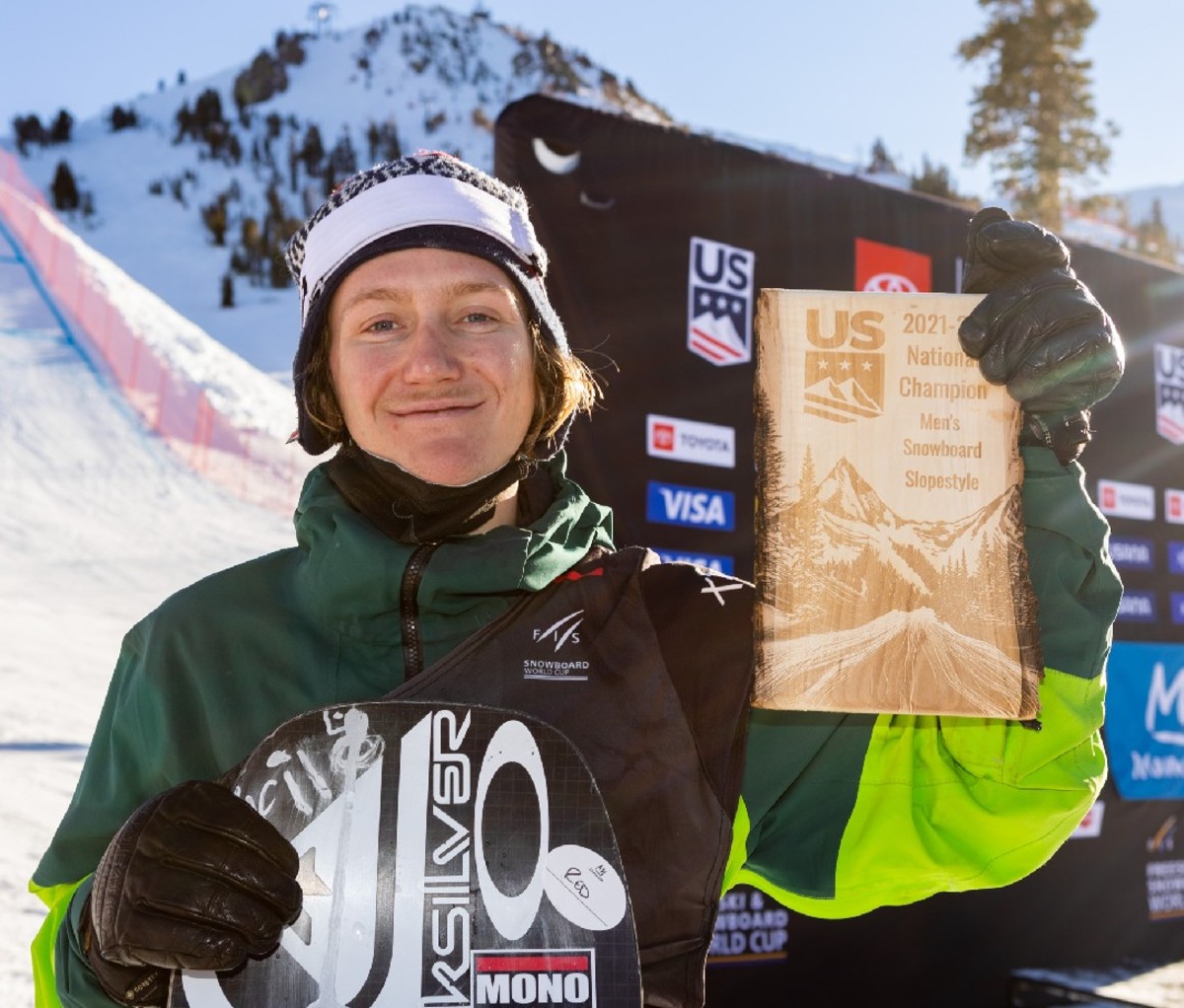 Close up of Red Gerard at the base of the slopes holding 