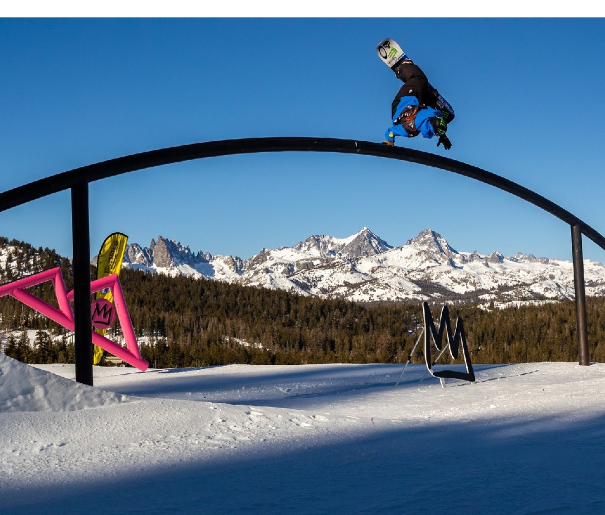 Dusty Henricksen doing a hand drag pull back on Mammoth's rainbow rail during his US Grand Prix run