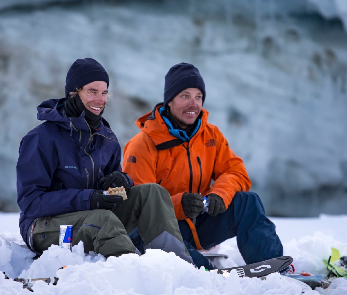 Jeremie Heitz and Sam Anthamatten sitting on the mountain in ski wear