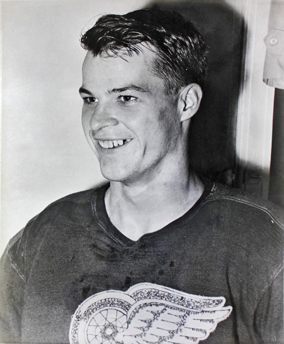 A young Gordie Howe smiles in a Detroit Red Wings jersey