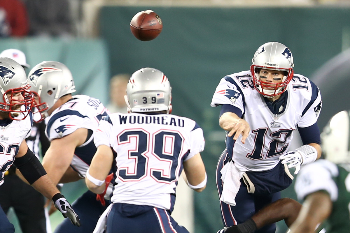 Patriots quarterback Tom Brady throws a pass during a game.