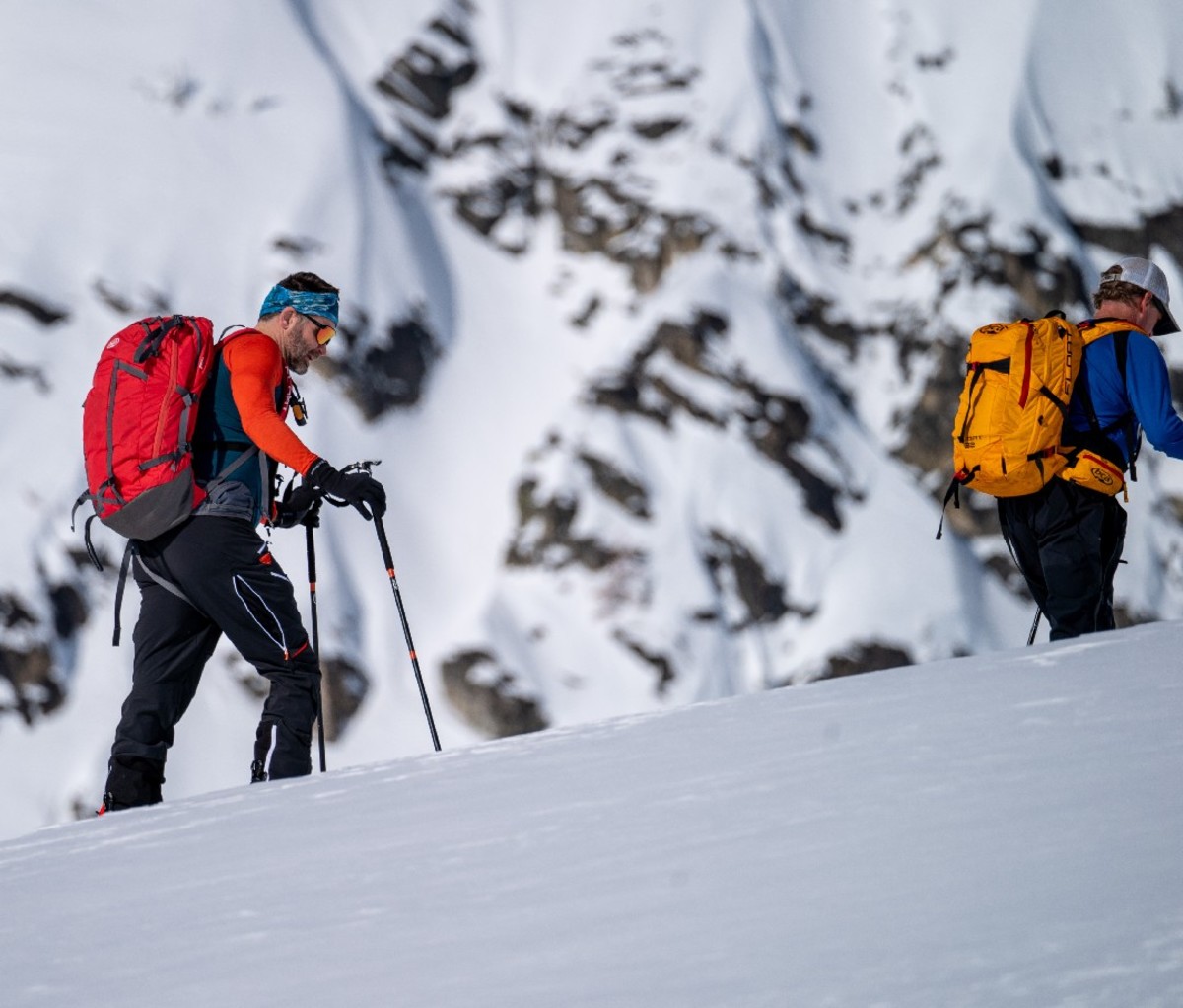 Two skiers skinning up a slope in British Columbia
