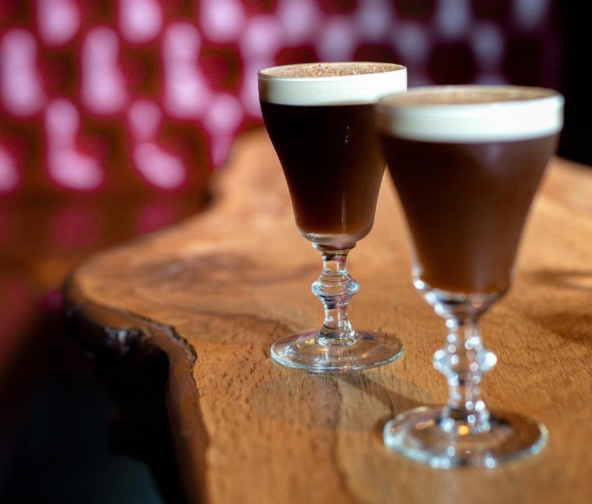 Coffee cocktail in glass with cream on top