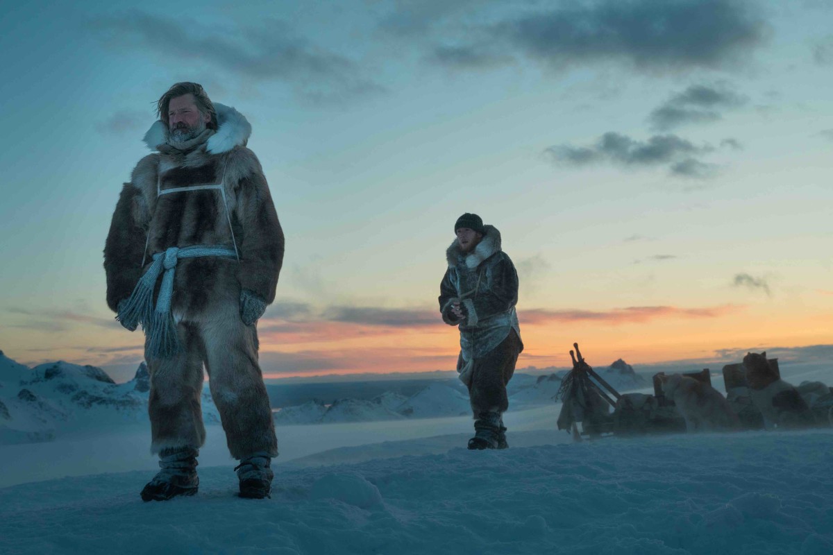 Nikolaj Coster-Waldau and co-star Joe Cole stand next their sled in the Arctic during a scene in "Against the Ice"