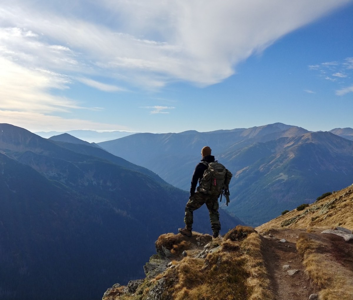 Man looking at mountains in distance