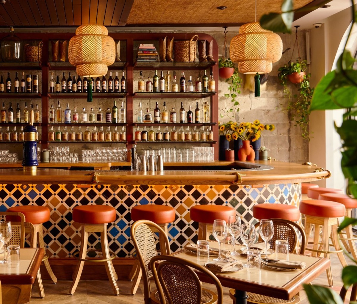 Bright bar with hanging lanterns and stools