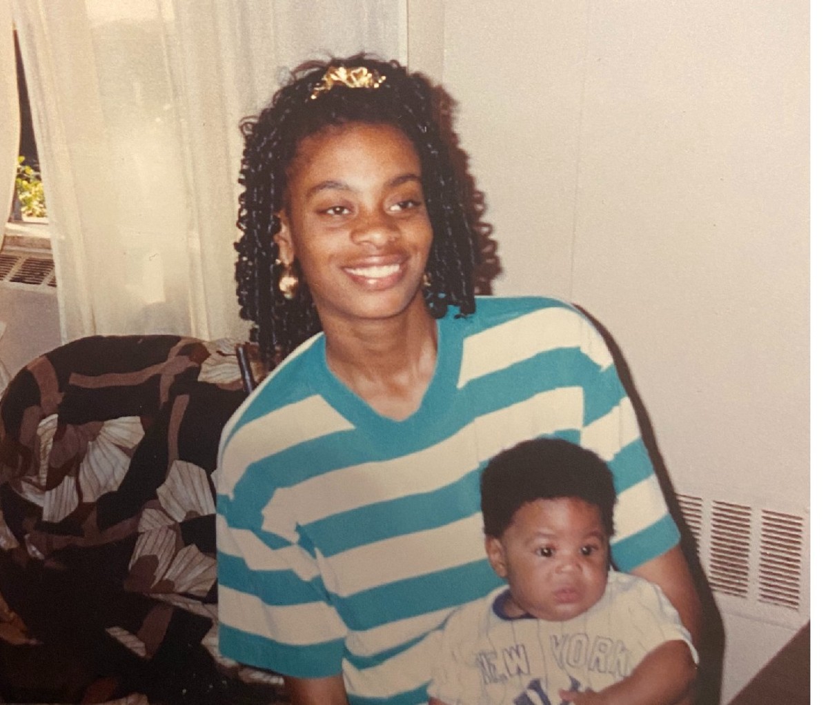 Blaise Ffrench as a baby seated on his mother's lap