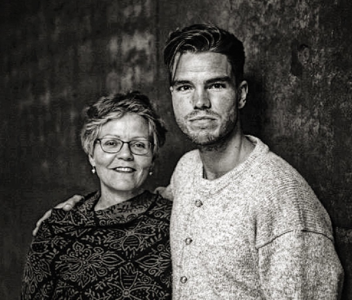 Black and white image of JJ Julius Son and his mom.