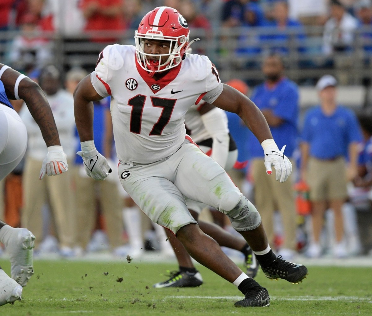 NFL Draft 2022: Nakobe Dean running on a football field.