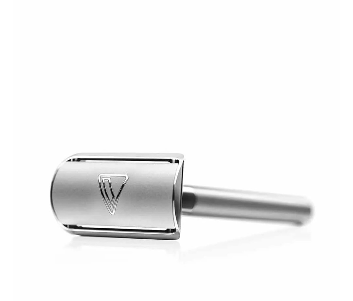 Safety razor on white backdrop