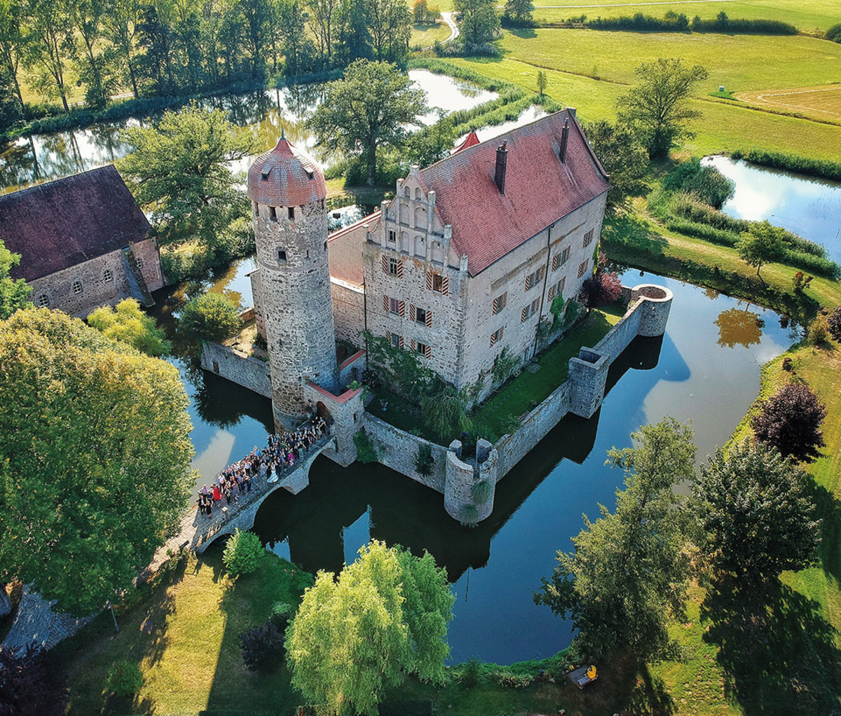 Castle on sprawling gronds with moat
