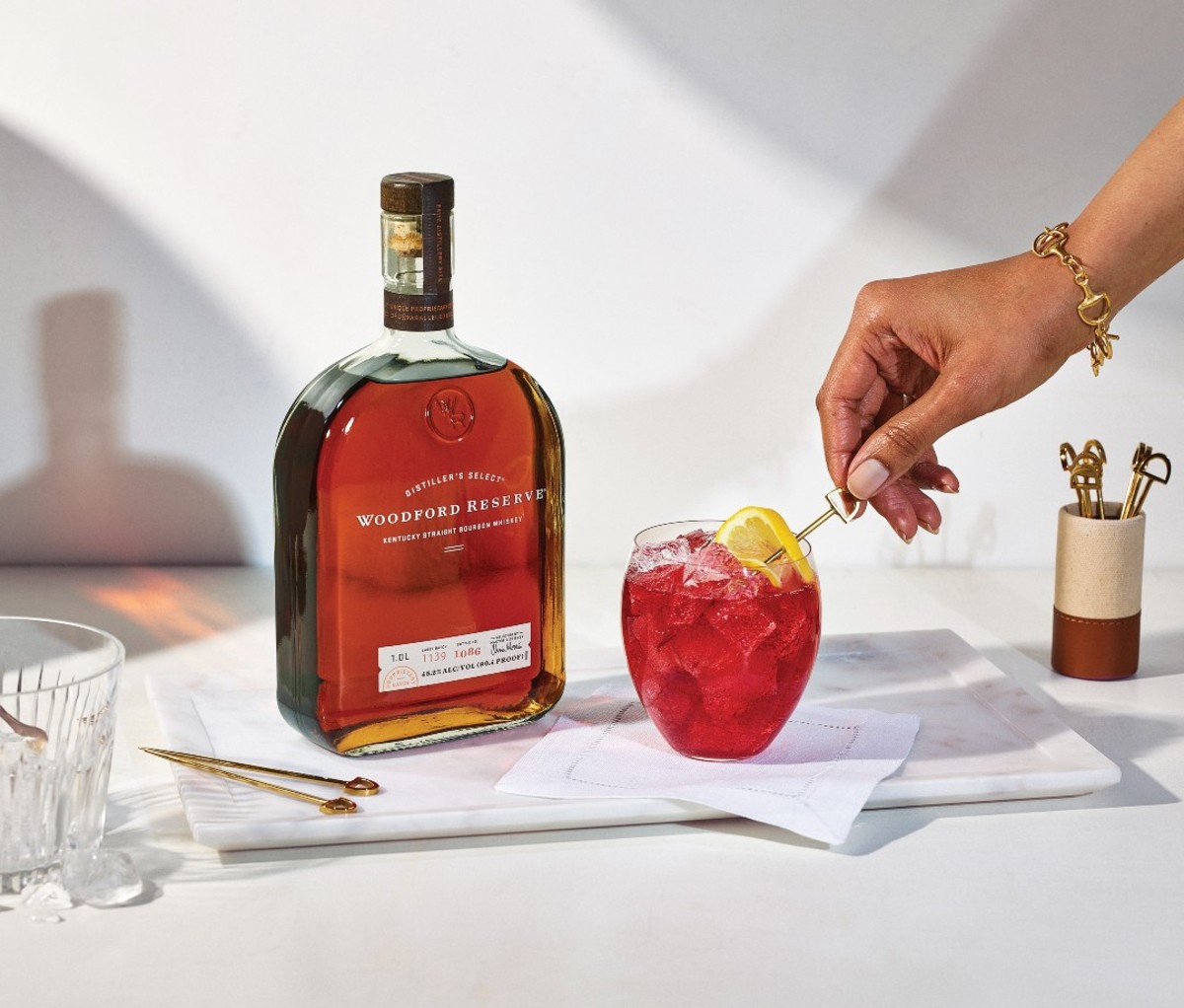Bottle of Woodford Reserve next to cocktail