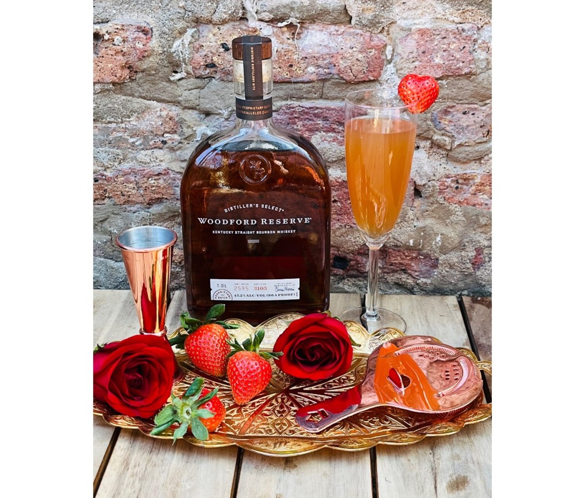 How to Make the Official $1,000 Kentucky Derby Bourbon Mint Julep: 2022 4 Bottle of Woodford Reserve next to cocktail