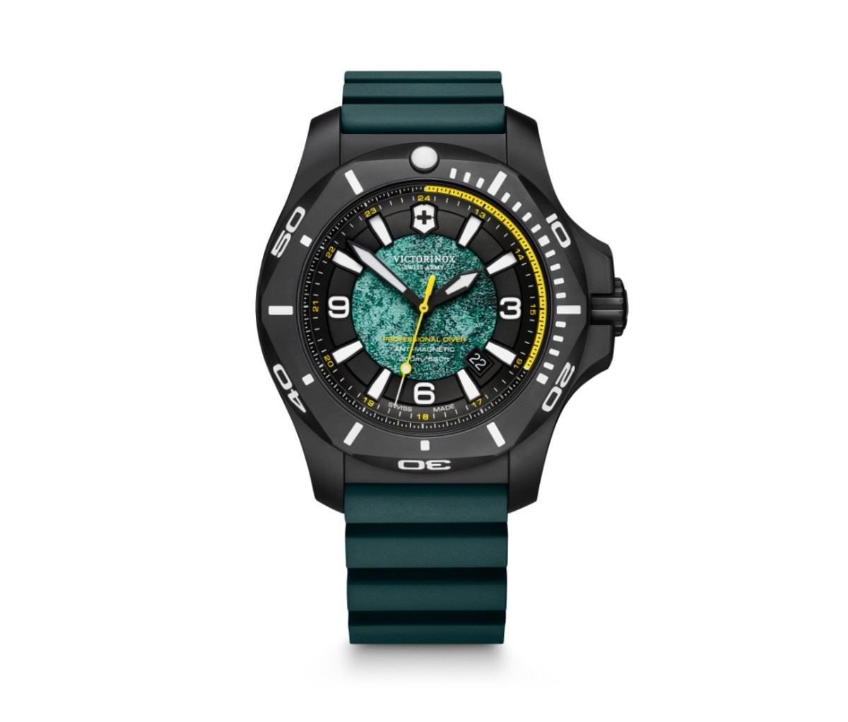 Green and black Victorinox I.N.OX. watch on a white background.