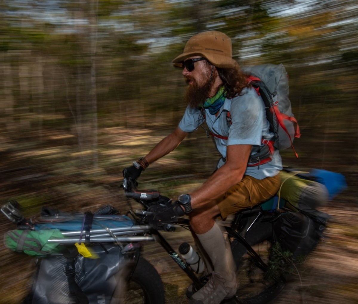 Blurry photo of a man on fat bike in jungle