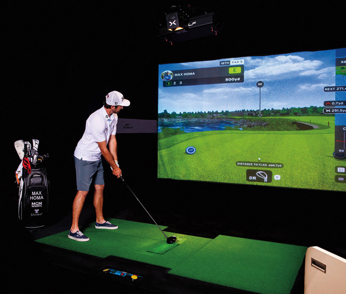Man using indoor golf simulator