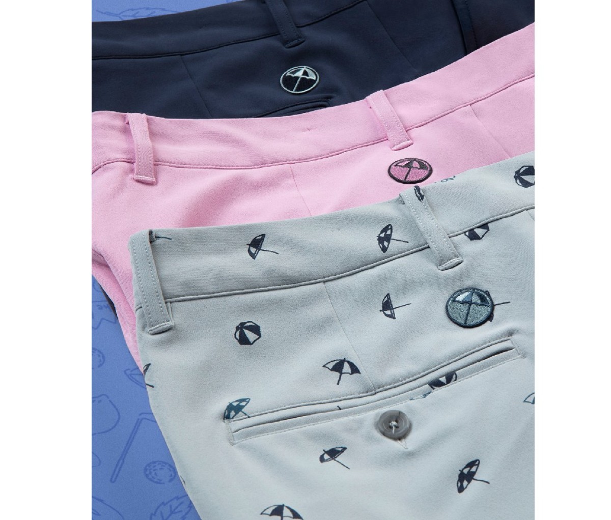 Assortment of Puma golf pants, gray, pink and navy