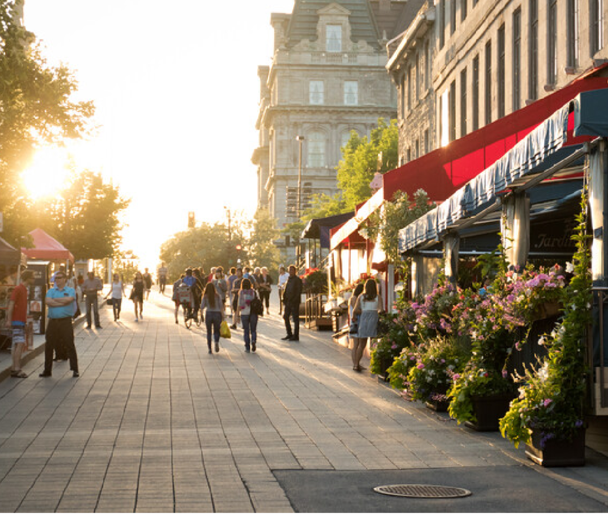 People walking along cobbstone street in Old Montreal