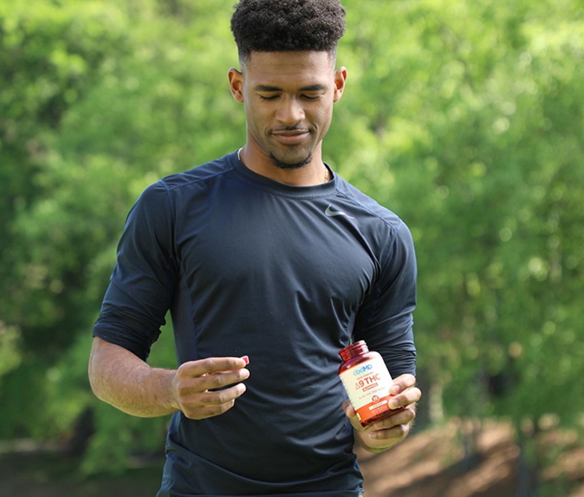 Man standing with cbd gummies