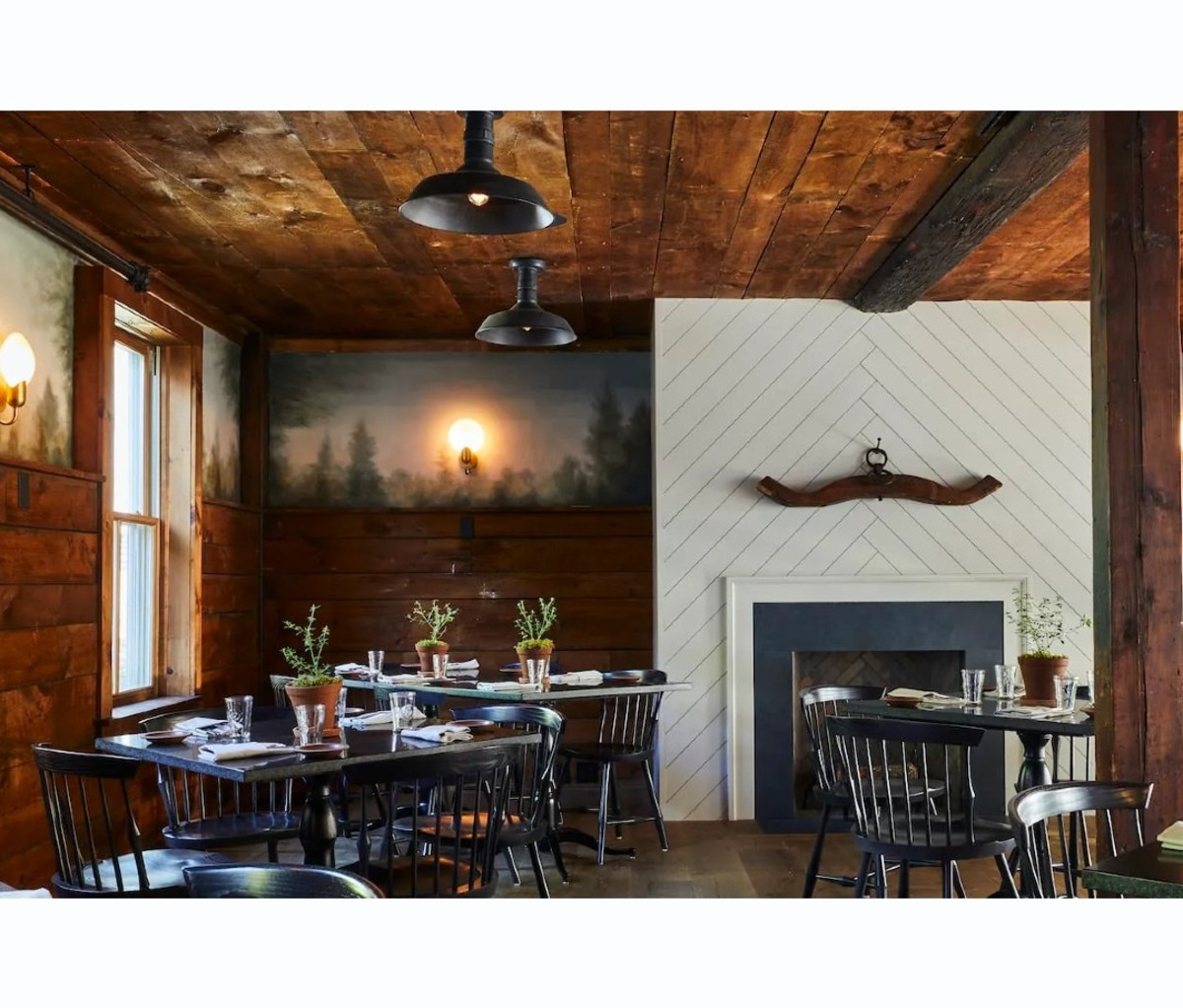 Interior of restaurant dining room with wood walls