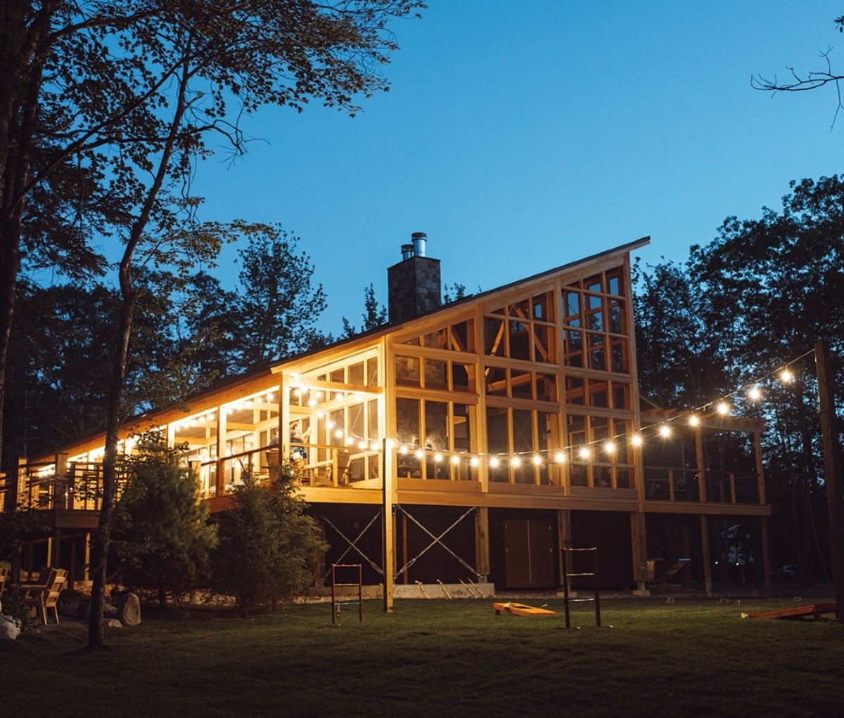 Glamping lodge with string lights at night