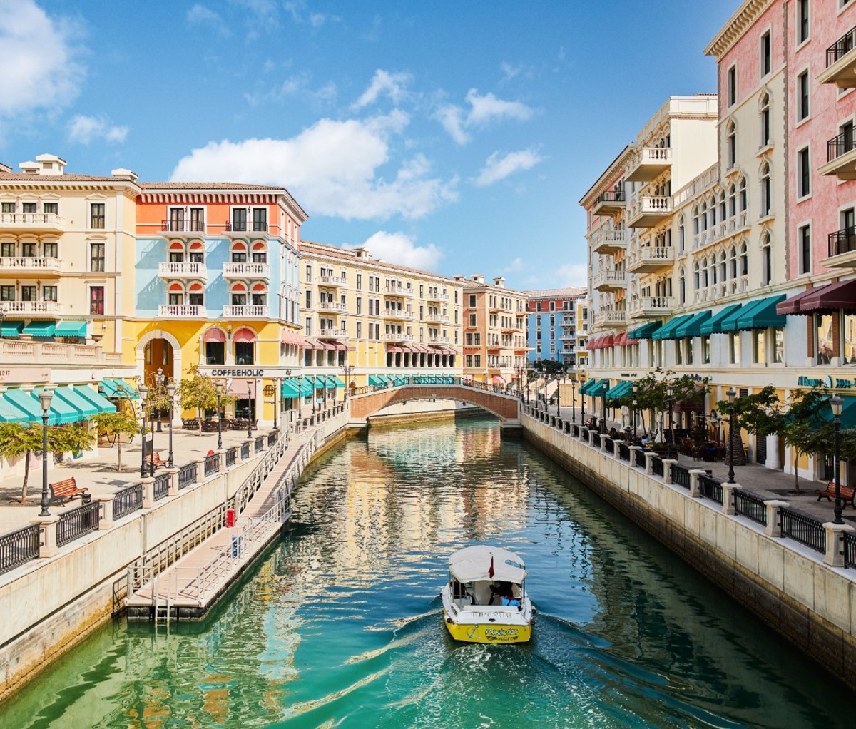 Artificial canal in Qatar with colorful buildings on either side