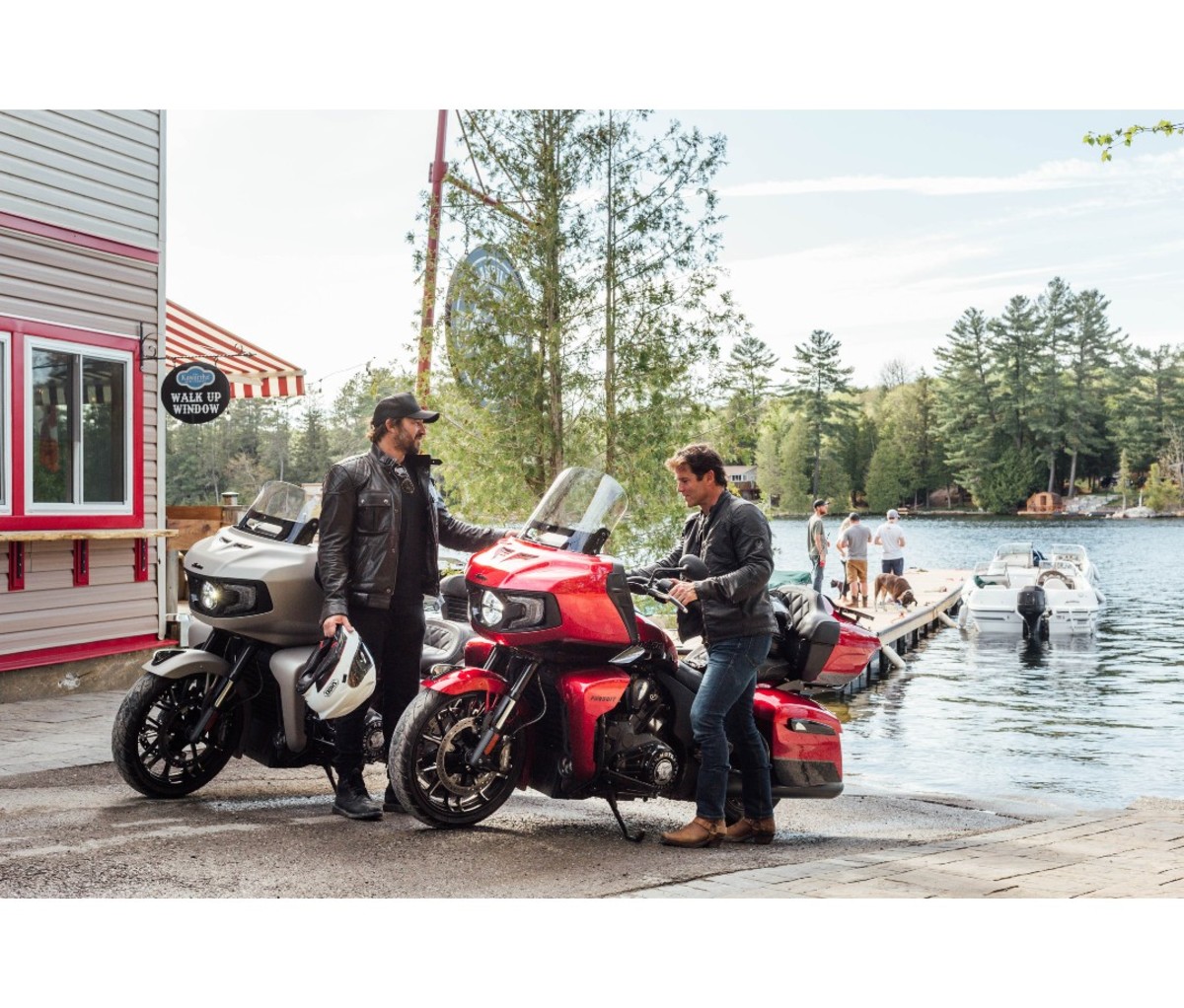 Two men next to Indian Pursuit Dark Horse motorcycles