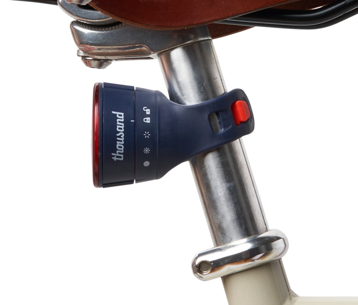 Thousand Traveler bike light attached to a bike seatpost on a white background.