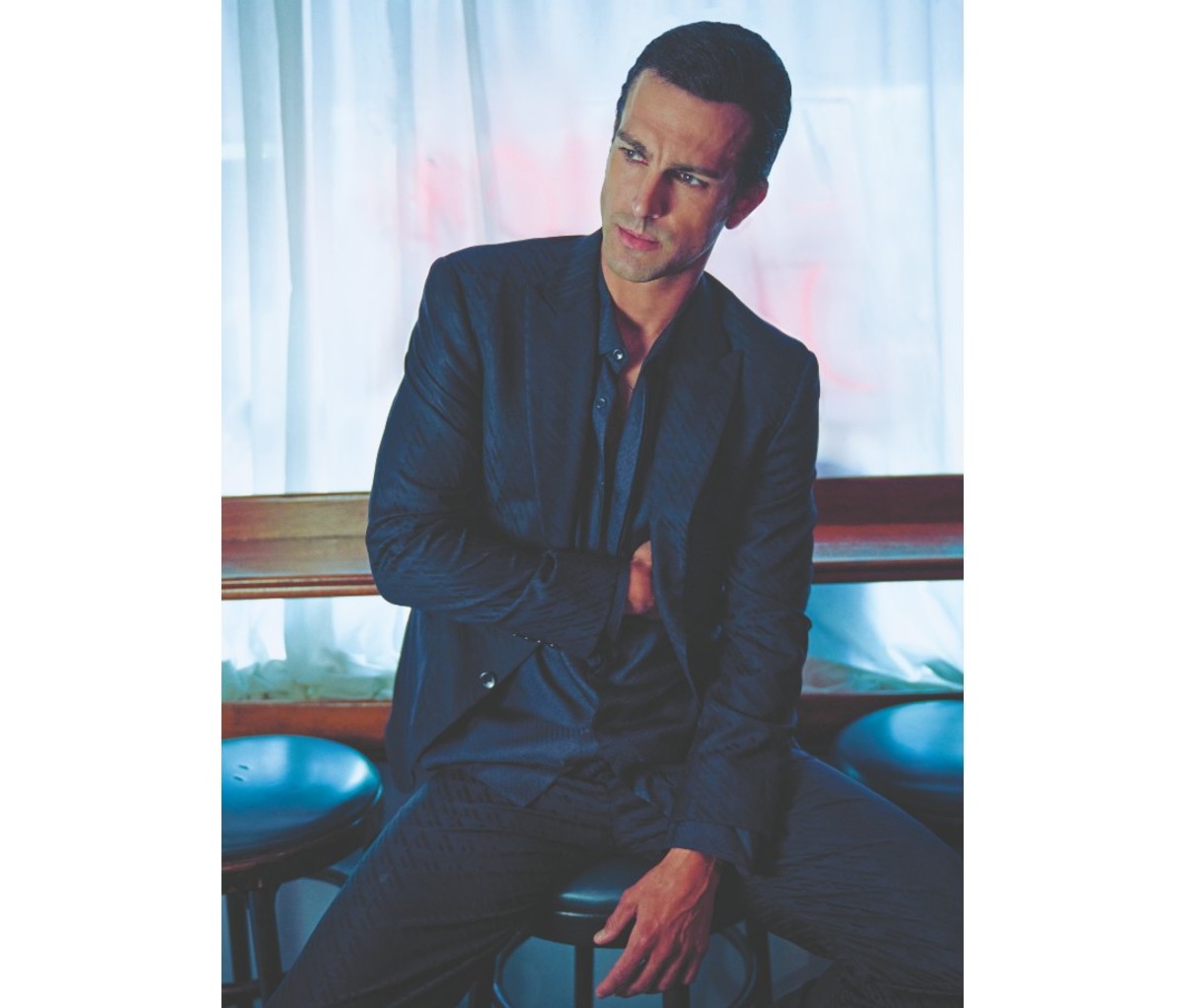 Man wearing Louis Vuitton Men’s Cutaway Jacket, Louis Vuitton Evening Long Sleeve Shirt, and Louis Vuitton Drawstring Pants