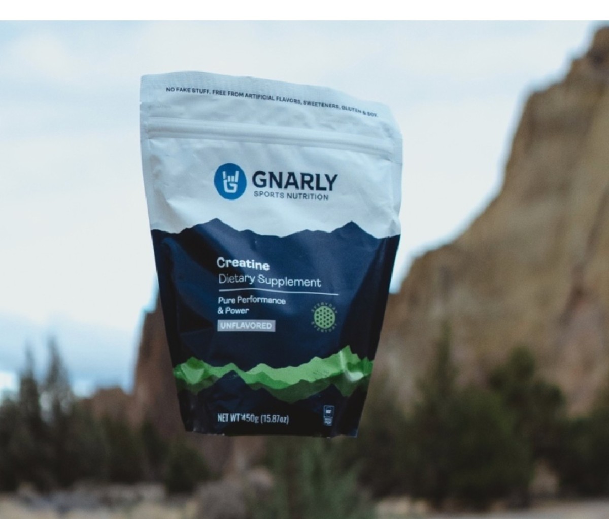 Bag of Gnarly Creatine "floating" above an outdoor scene background.