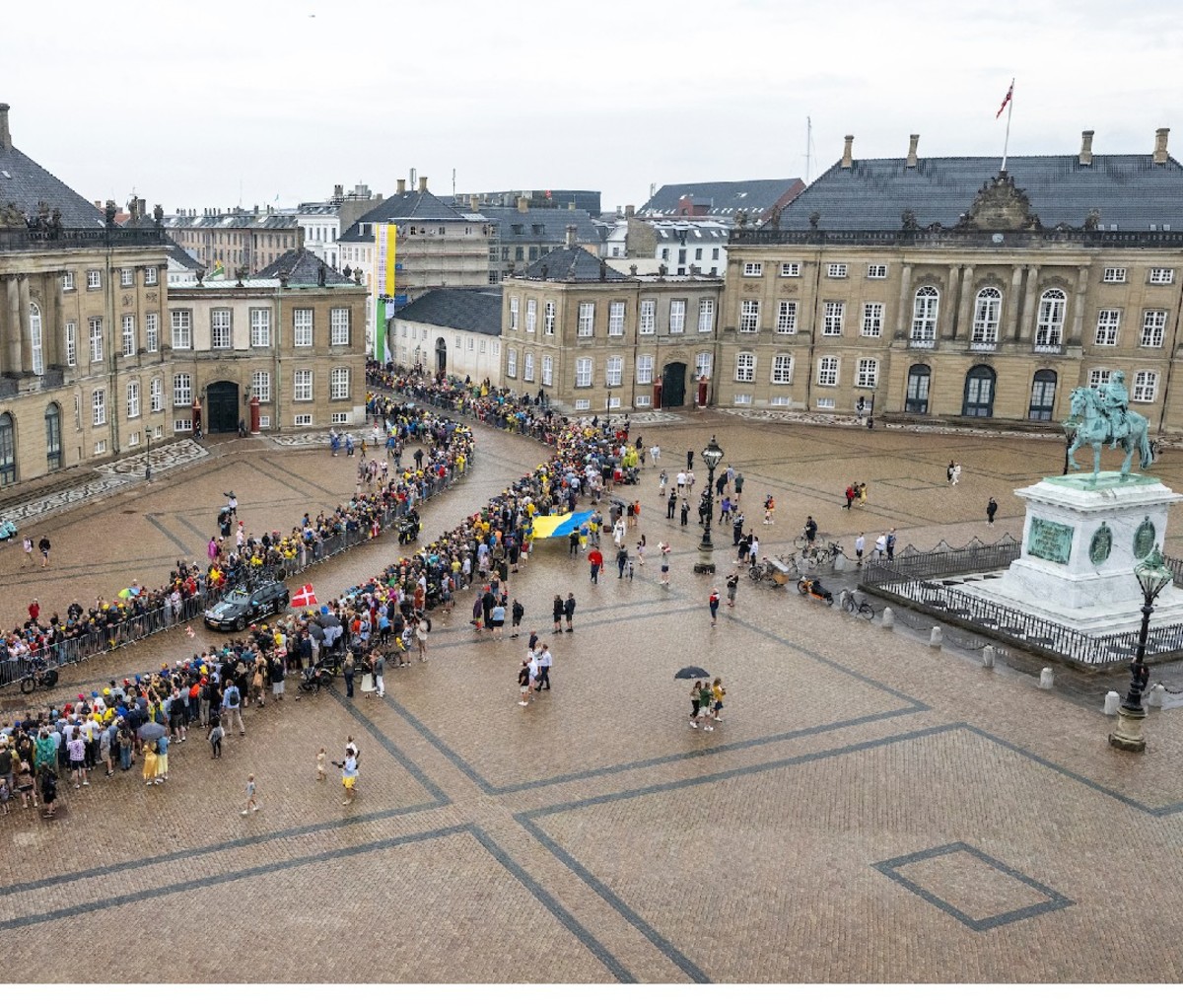 Cycling crowds gather in a historic square in Denmark during the 2022 Tour de France