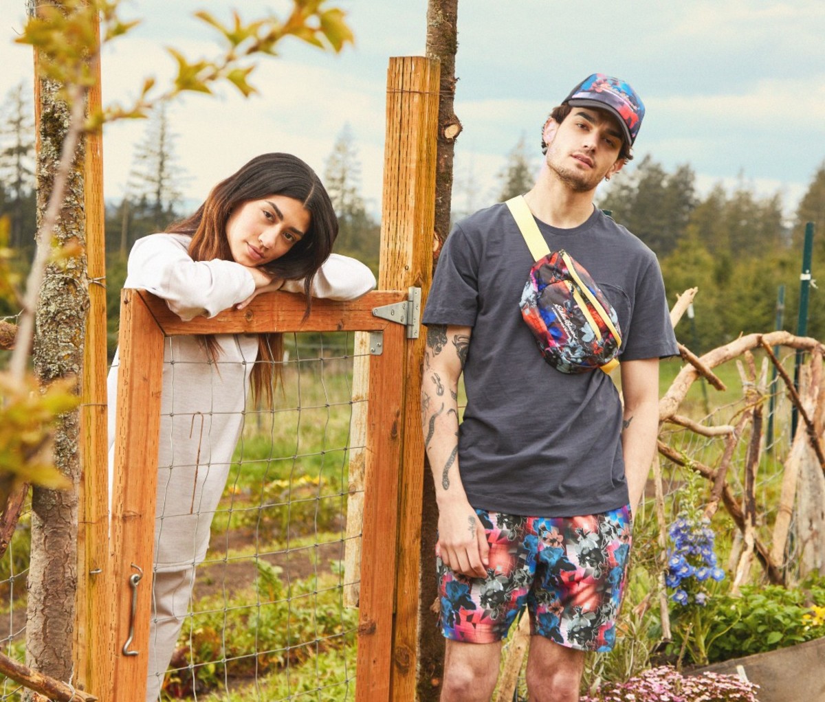 Man and woman on farm posing in colorful clothing