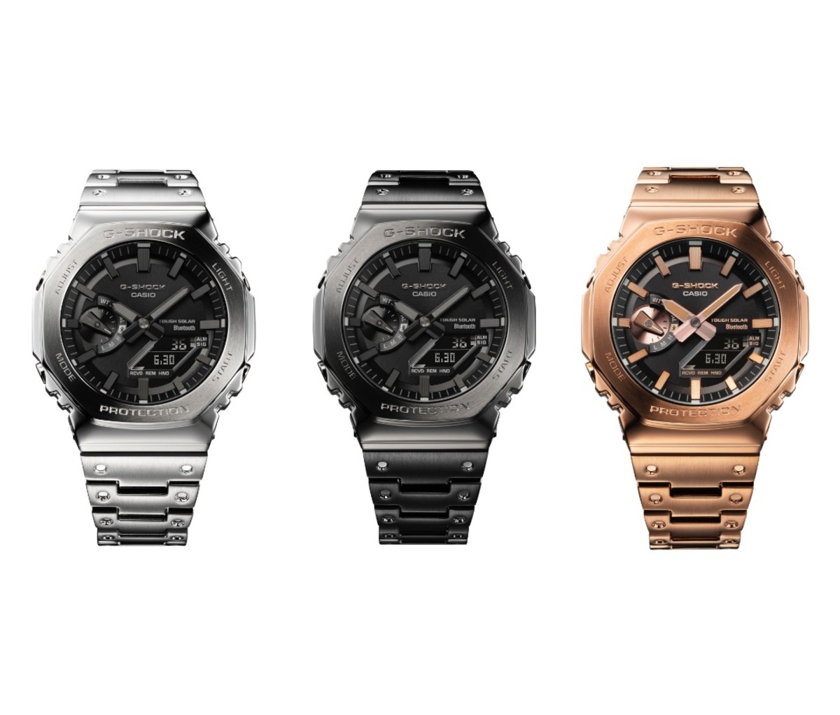 Three G-SHock GMB2100 watches in silver, black, and bronze finishes.