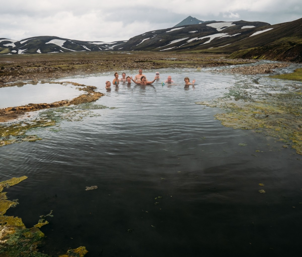 Group of people soaking in a hot spring in Iceland. 57hours