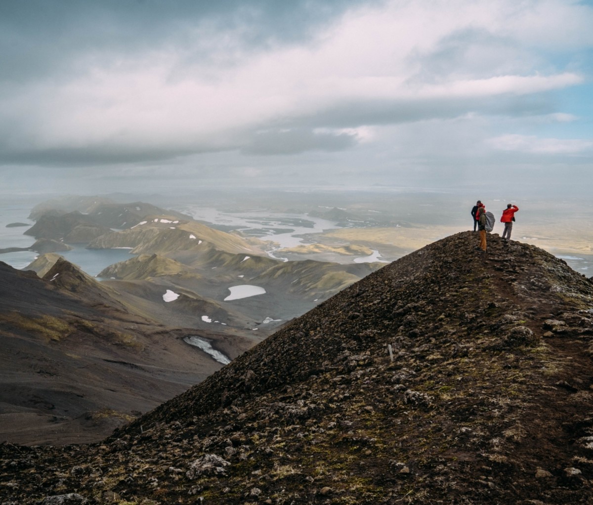 Two people on a mountain peak on a 57hours trip in Iceland.