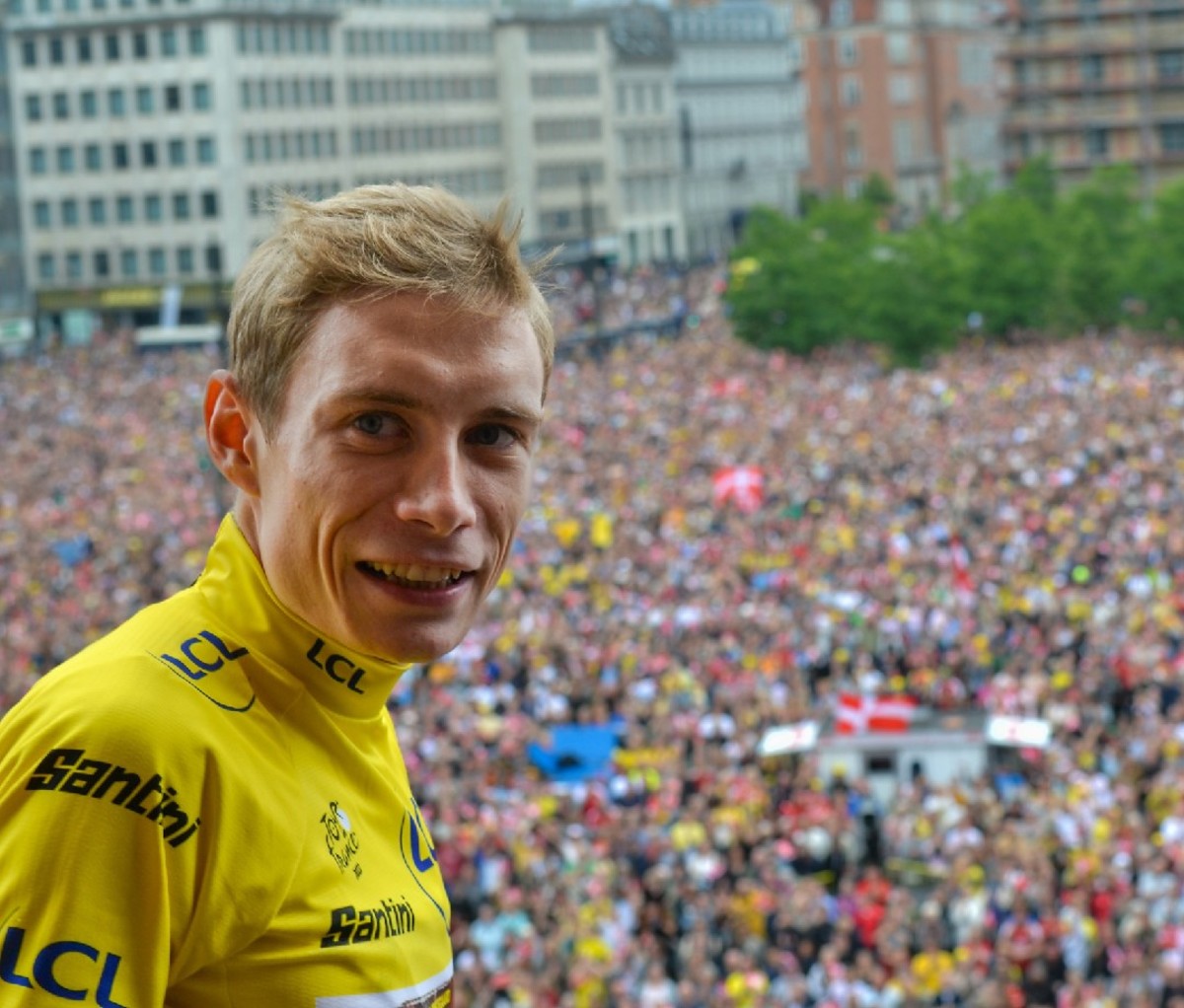 2022 Tour de France champion, Denmark's Jonas Vingegaard, wearing his yellow jersey with crowd in the background