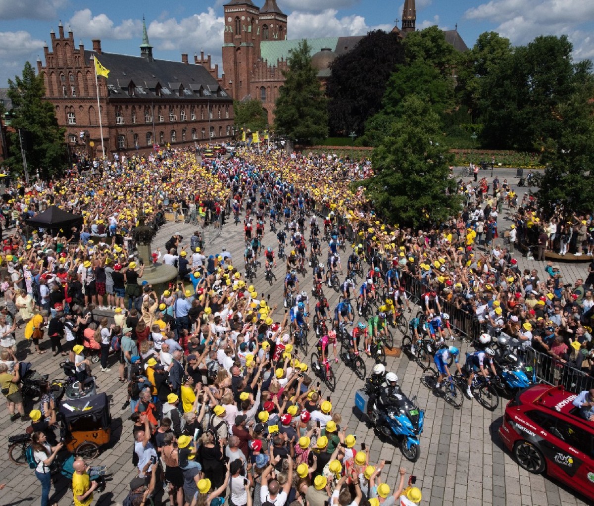 Cyclers pedal past fans in Denmark town during the 2022 Tour de France
