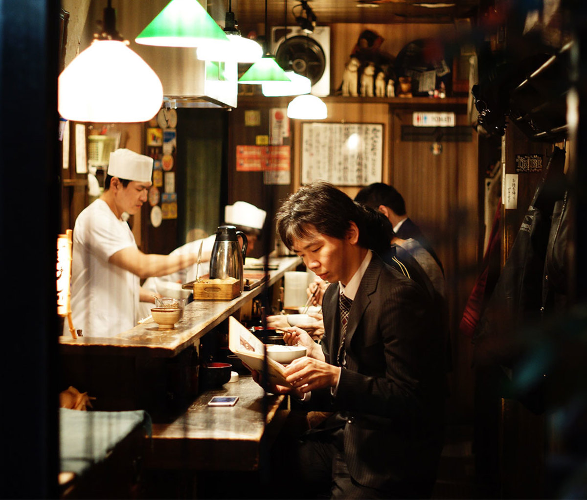 Man sitting at counter in Tokyo restaurant