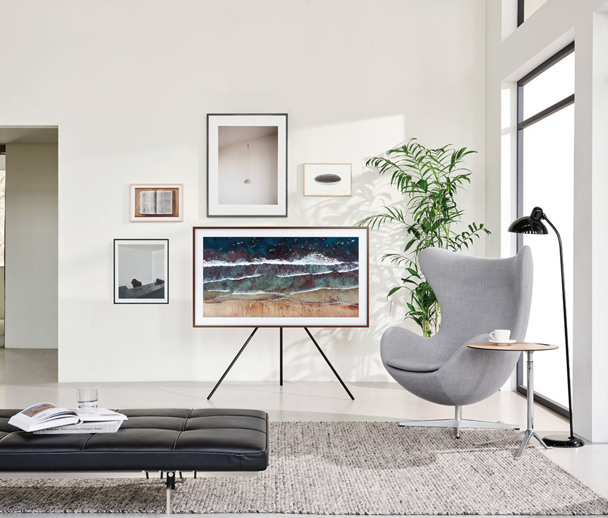 The Frame TV on an easle with photos surrounding it