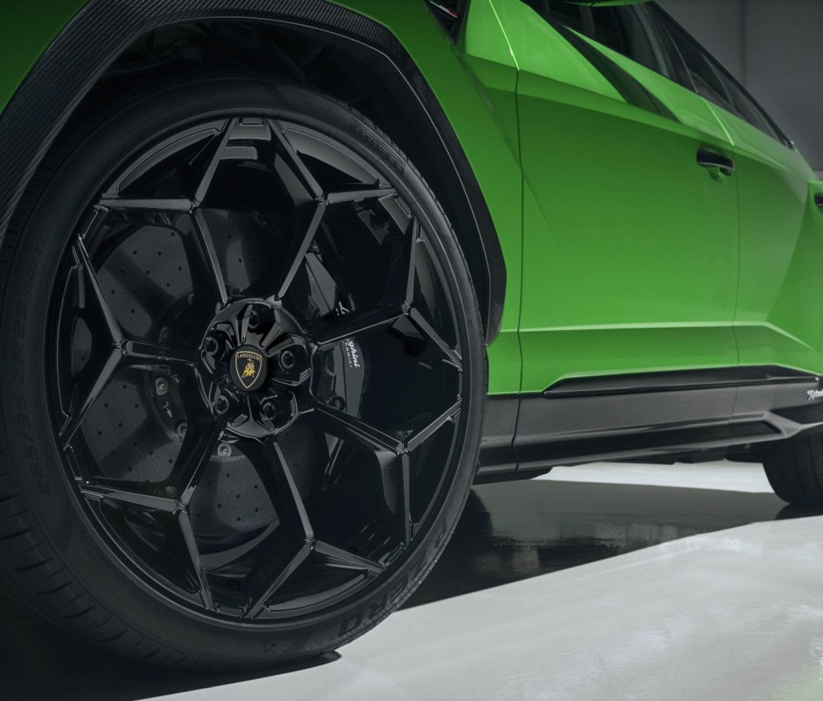 Closeup of green sports car's tires