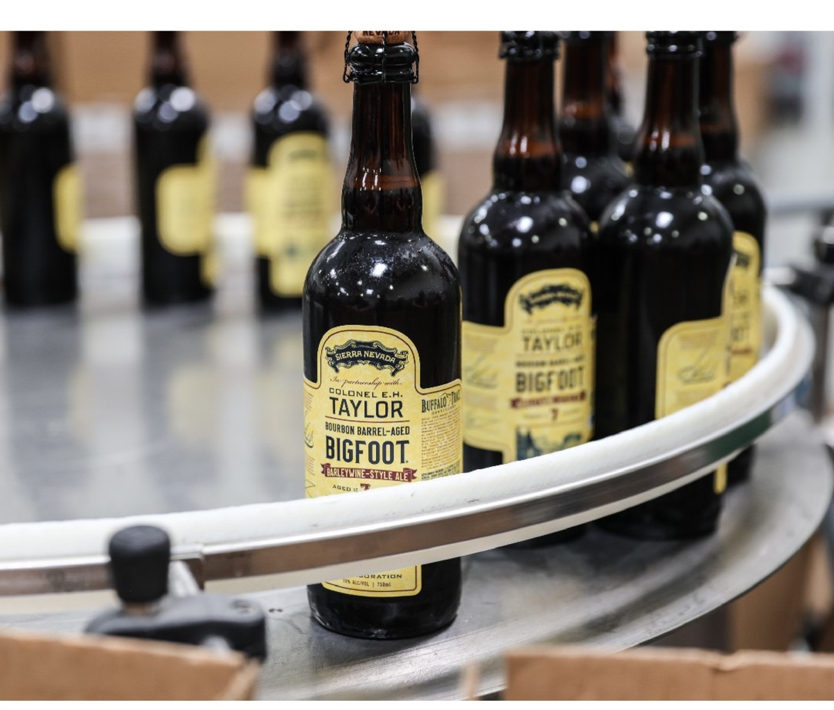Bottles of Sierra Nevada’s Buffalo Trace Barrel-Aged Bigfoot Barleywine on a metal production table.