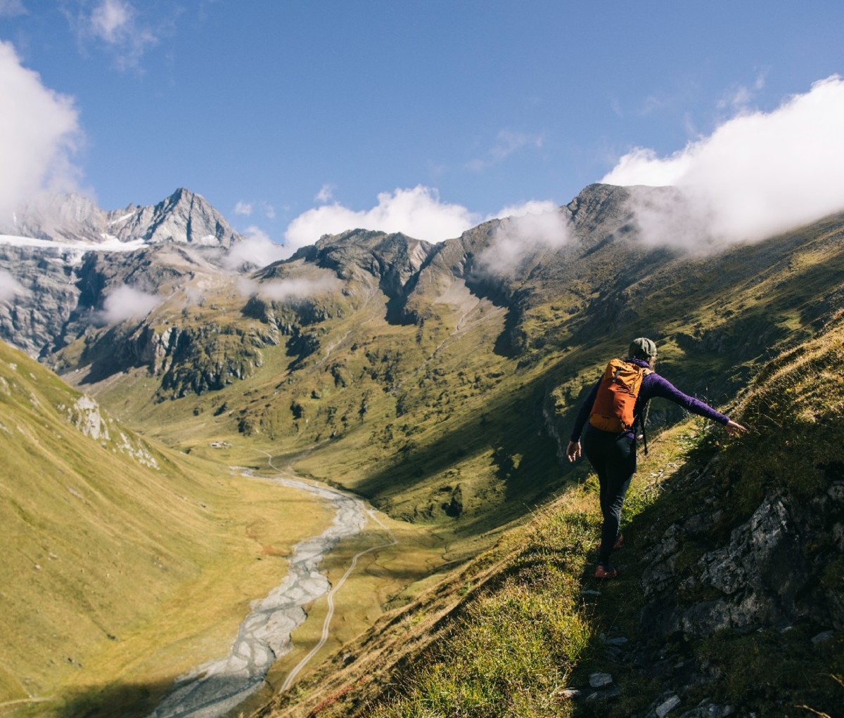 Hiker standing beside the trail on Austria's Eagle Way.