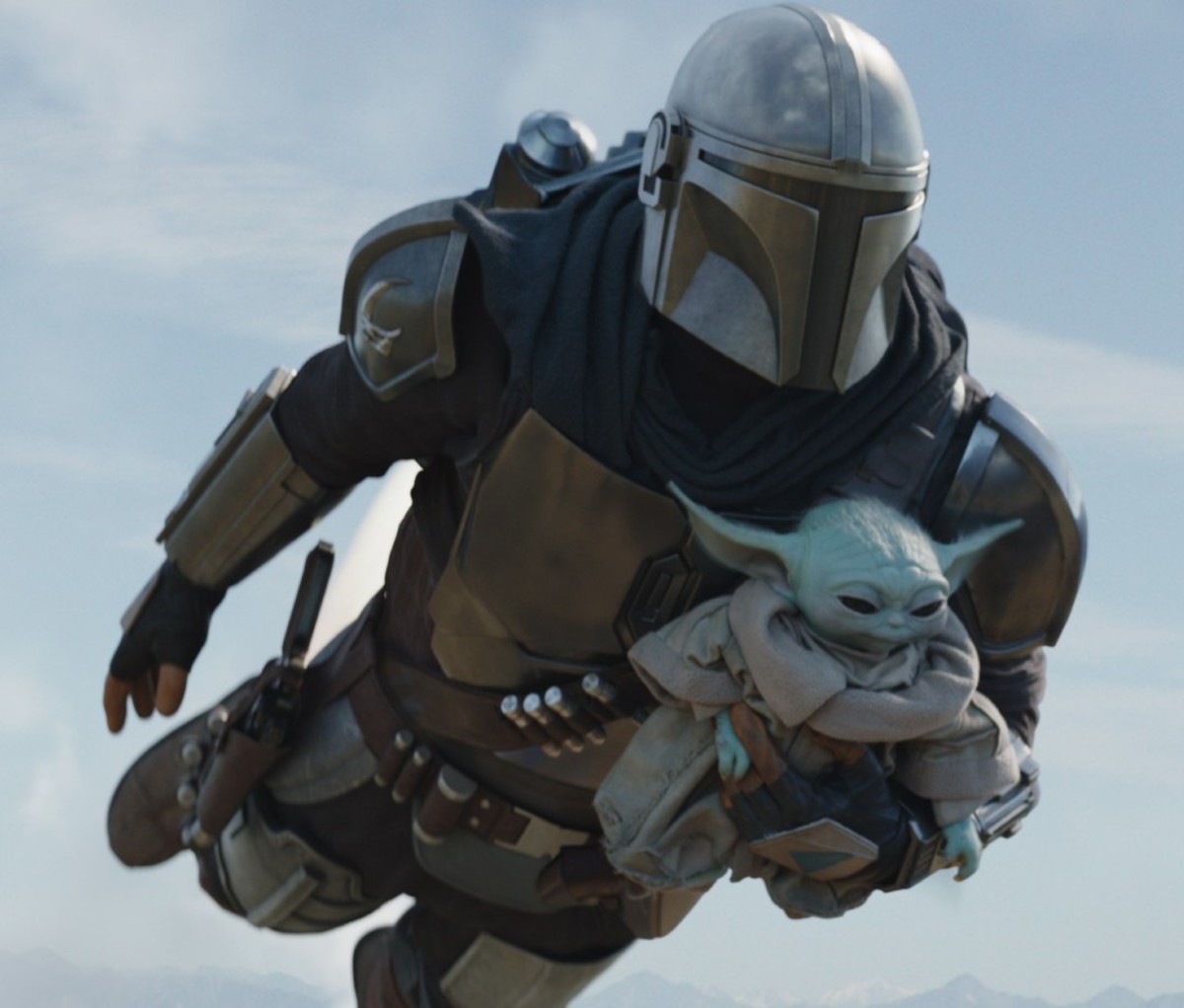 The Mandalorian (Pedro Pascal) and Grogu in Lucasfilm's THE MANDALORIAN, season two, exclusively on Disney+. © 2020 Lucasfilm Ltd. & ™. All Rights Reserved.