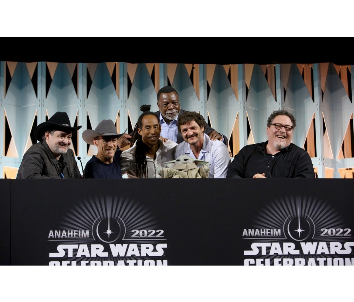 (L-R) Dave Filoni, Brendan Wayne, Lateef Crowder, Carl Weathers, Pedro Pascal and Jon Favreau attend the panel for “The Mandalorian” series at Star Wars Celebration in Anaheim, California on May 28, 2022. (Photo by Jesse Grant/Getty Images for Disney)