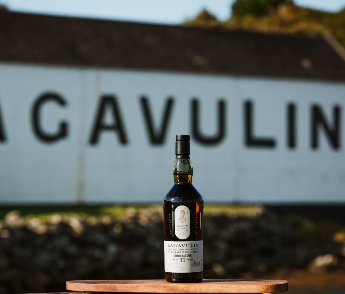 Bottle of Lagavulin Offerman Edition: Charred Oak Cask with building in background that reads Lagavulin