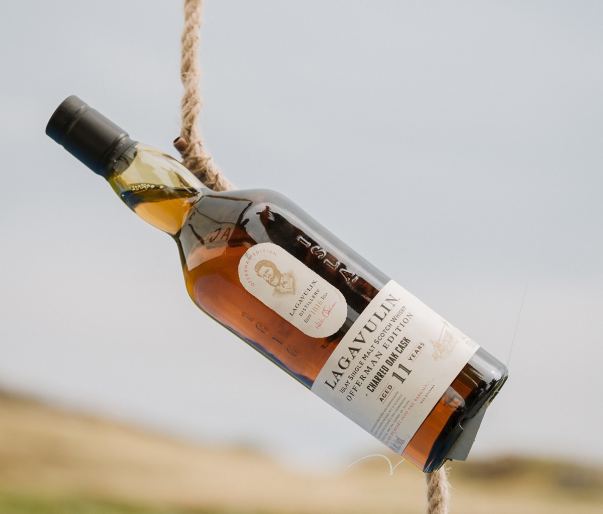 Bottle of Lagavulin Offerman Edition: Charred Oak Cask with rope around it