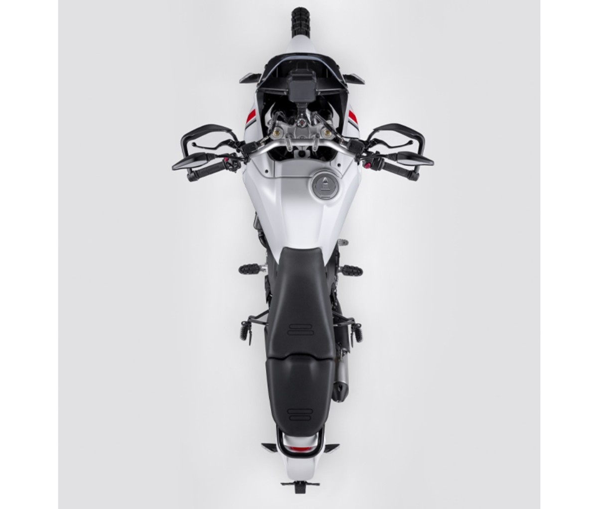 Top down shot of an adventure motorcycle on an off-white background.