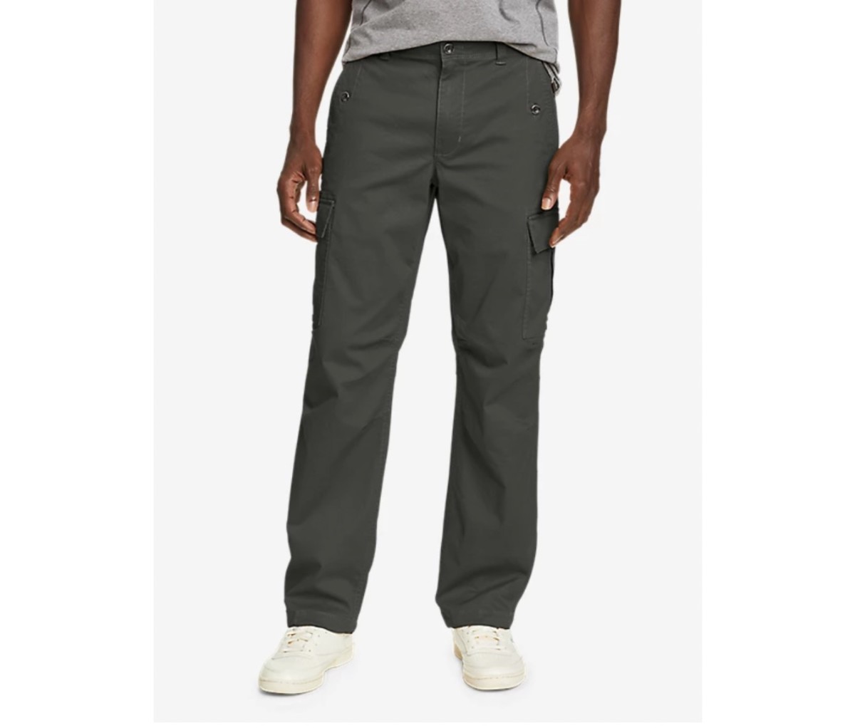 Man with grey t-shirt and green cargo pants on white background.