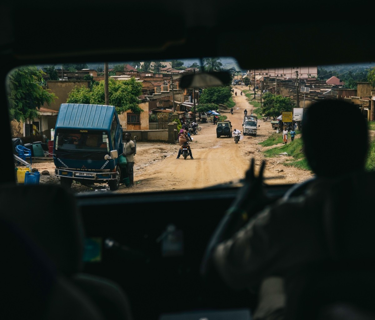 African village as seen through the back of a Land Rover