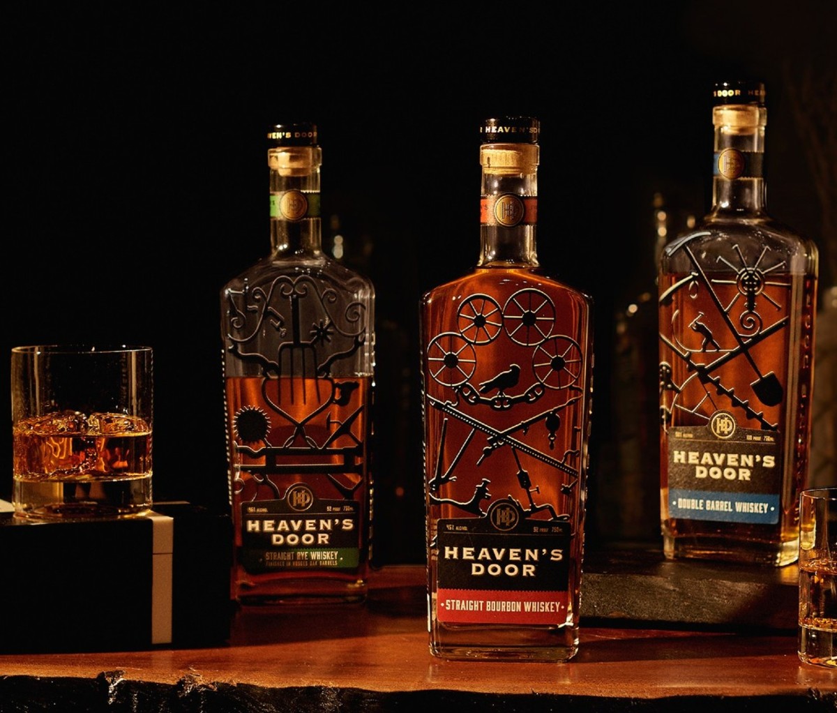 Trio of whiskey bottles with wrought iron artwork